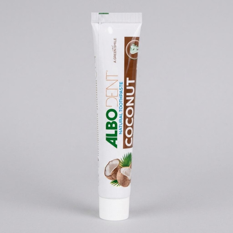 خمیر دندان ضد عفونی کننده دهان آلبودنت مدل Coconut با طعم نارگیل مناسب برای همه دندانها وزن 50 گرم