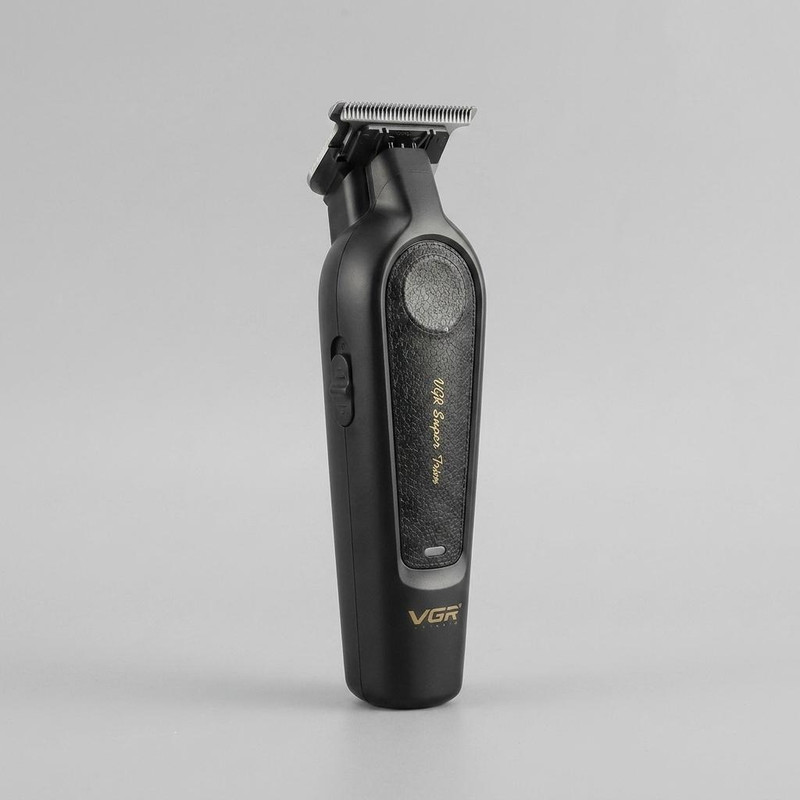 ماشین اصلاح موی سر و صورت وی جی آر مدل V-995 با تیغه کربن استیل، باتری لیتیوم یون 2000 میلیآمپر ساعت، شارژ USB، قابلیت تنظیم سرعت و طراحی ارگونومیک و سبک