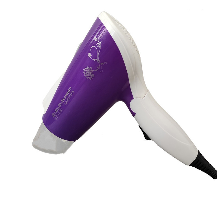 سشوار مسافرتی مدل st-1030 با توان 1600 وات، موتور AC، تنظیم دما یک حالته، تنظیم سرعت دو سرعته، صافکنندگی و حجمدهندگی، وزن 328 گرم، کاربرد خانگی